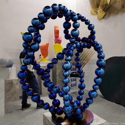 Highly polished welded metal colored sphere combined sculpture Highly polished welded metal colored sphere combined sculpture