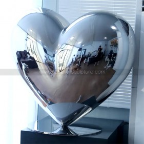 Mirror polished stainless steel love sculpture