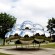 Public art installation large mirrored stainless steel sphere sculpture