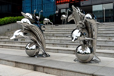 Stainless steel dolphin sculpture.