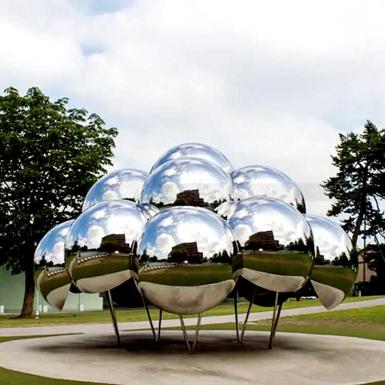 Public art installation large mirrored stainless steel sphere sculpture