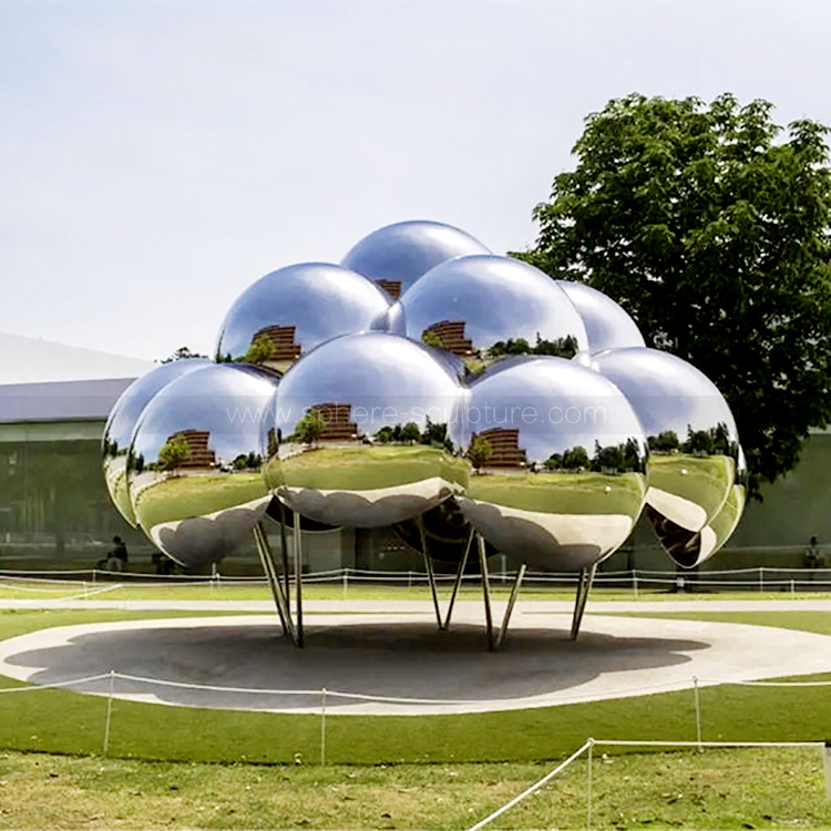 Public art installation large mirrored stainless steel sphere sculpture