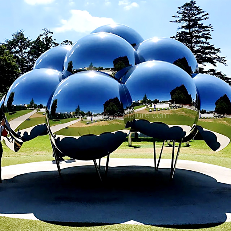 Public art installation large mirrored stainless steel sphere sculpture
