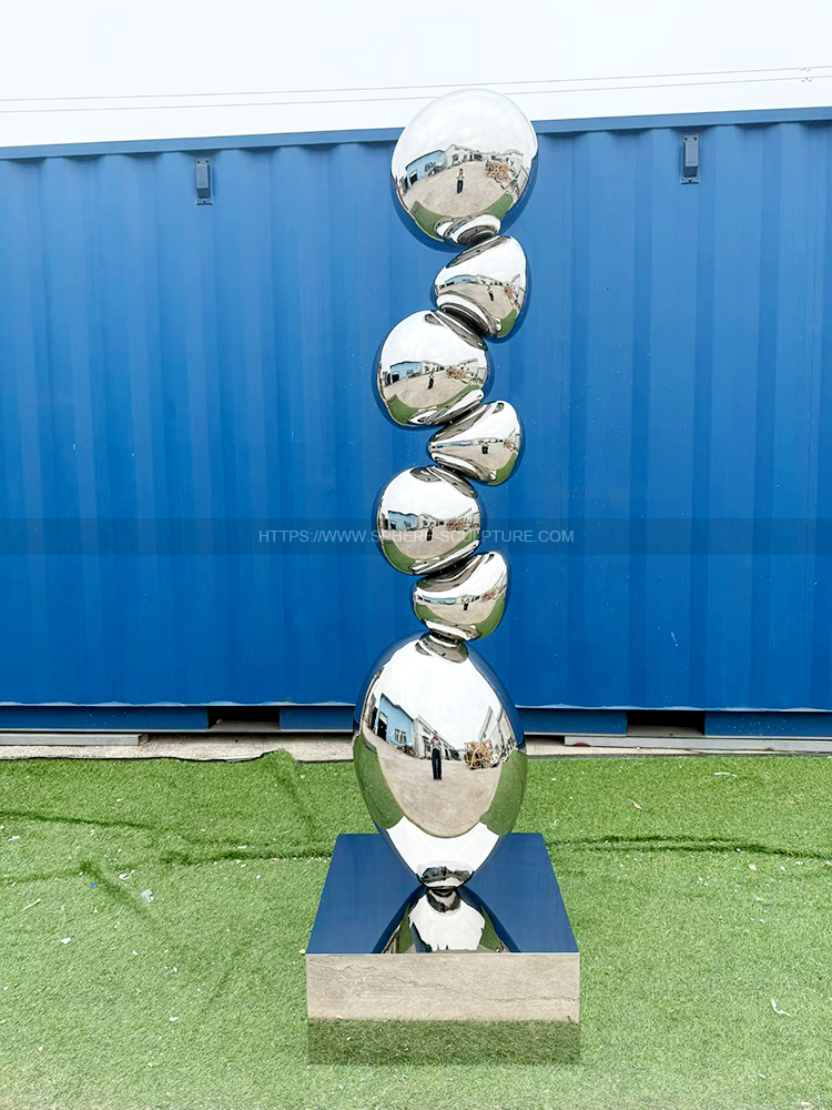 Mirror polished stainless steel rock sculpture