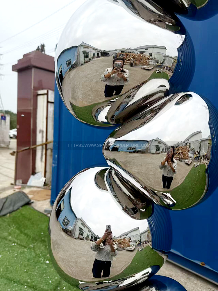 Mirror polished stainless steel rock sculpture